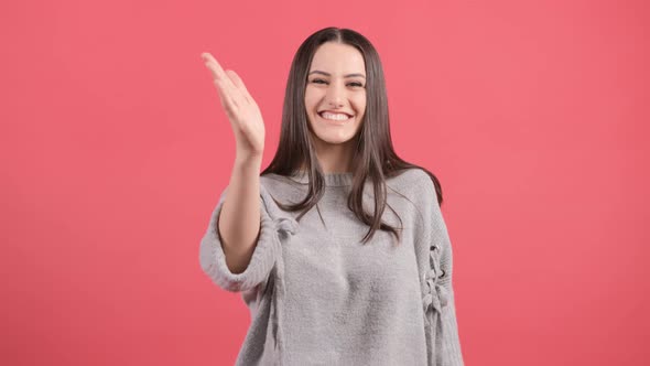 Friendly Beautiful Woman Saying Hi and Going To Shake Hands with Somebody