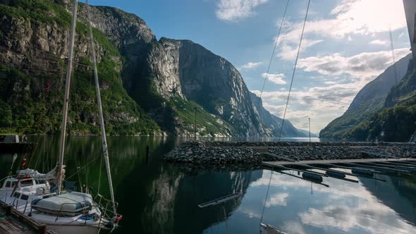 View Of Moored Boat And Mountains In Lake