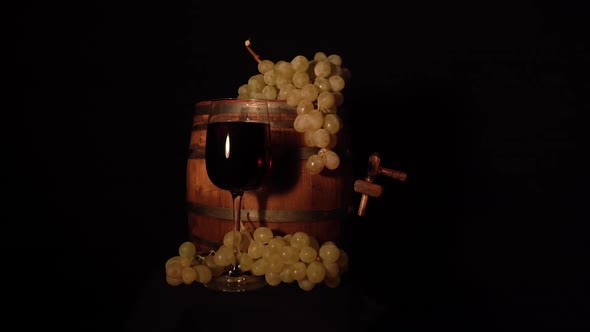 More accurate backward rotating wine barrel with grape and glass of wine.