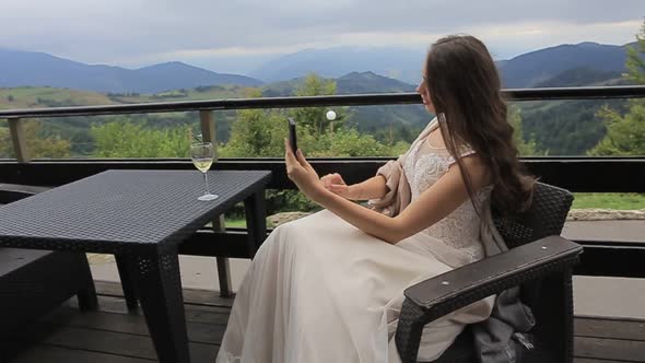 the Girl Drinks White Wine Sexy Young Woman with Glass of Wine