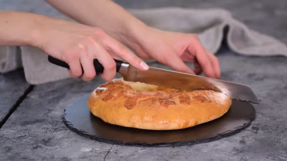 Freshly Baked Khachapuri with Cheese on a Table