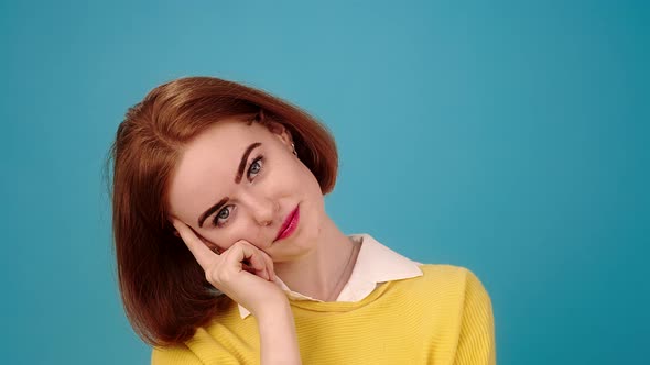 Woman with Red Hair Looks Smiling