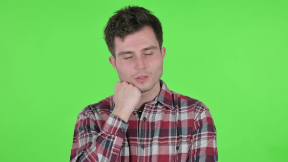 Portrait of Young Man Taking Nap Green Chroma Screen