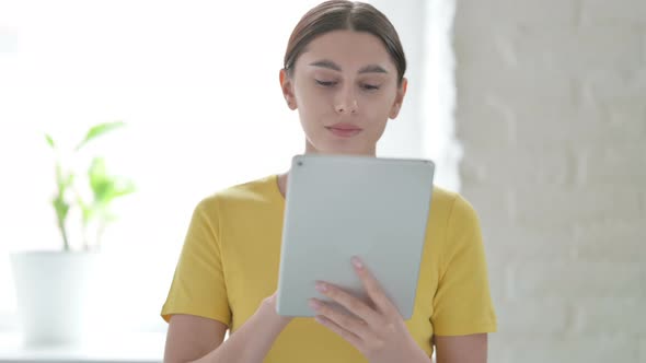 Portrait of Woman using Tablet in Office