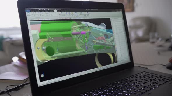 3d graphic designer is working on a rifle concept with a hi-tec mouse.