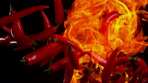 Super Slow Motion Shot of Red Chilli Peppers and Fire at 1000Fps