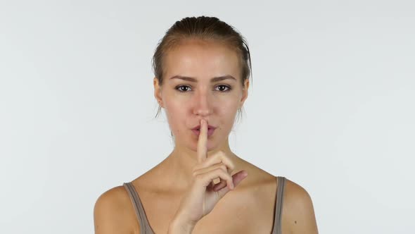 Silence Gesture by Beautiful Girl, White Background