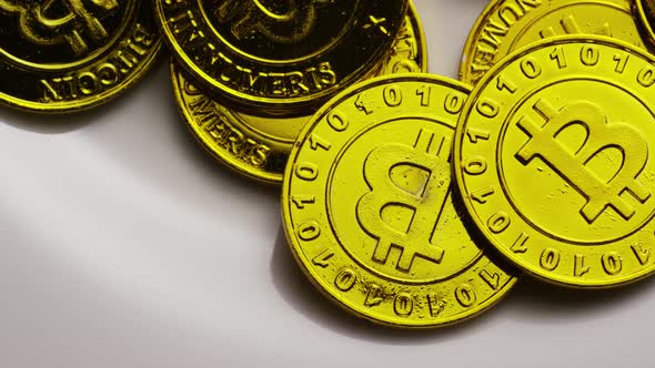 Rotating shot of Bitcoins (digital cryptocurrency) - BITCOIN