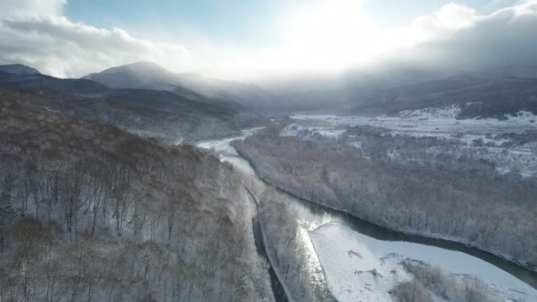 Aerial View of Plateau LagoNaki Mountain Twisted Road in the Winter and Driving Car