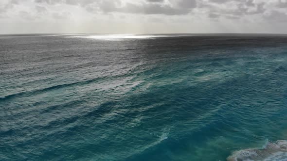 Turquoise Ocean Water Wave View From Height to the Shining and Sparkling Surface