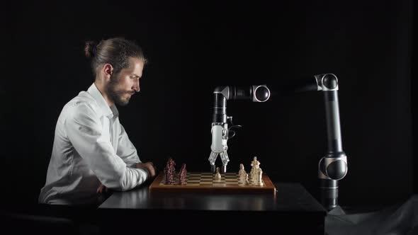 Modern Technology, Man Playing Chess with a Robot, the Confrontation Between Man and Artificial