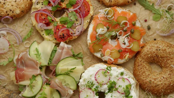 Tasty Colorful Various Bagels with Healthy Ingredients Served on Brown Baking Paper