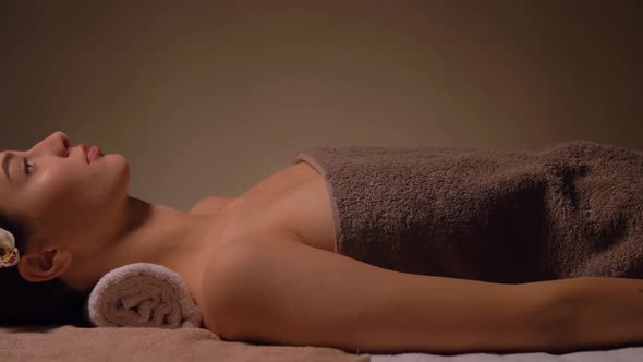 Young Woman Lying at Spa or Massage Parlor