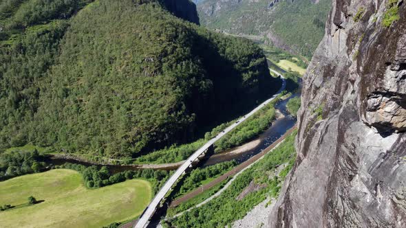 Downwarding aerial along mountain wall - Watching Norway highway E-16 between Bergen and Voss with r