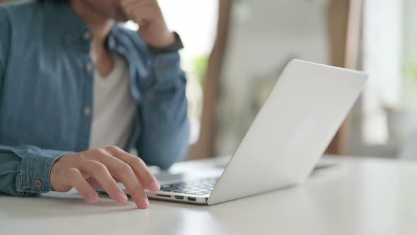 Close Up of Man Thinking While Using Laptop