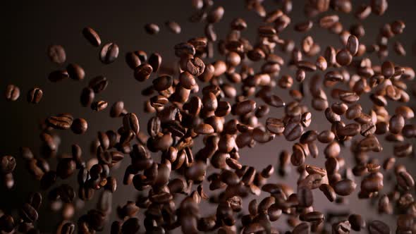 Super Slow Motion Shot of Exploding Premium Coffee Beans on Brown Gradient Background at 1000Fps