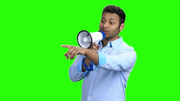 Cheerful Young Man with Megaphone on Green Screen