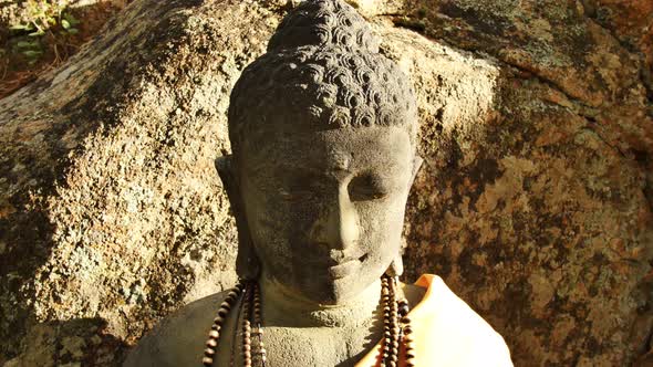 Close-up of a stone Buddha's face at the stupa in Red Feather Lakes, CO