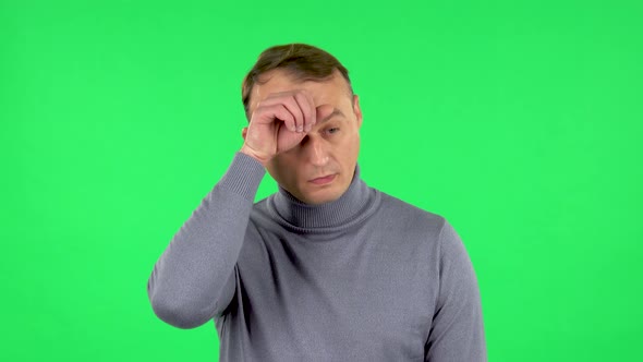 Portrait of Male Is Tired and Sighs. Green Screen