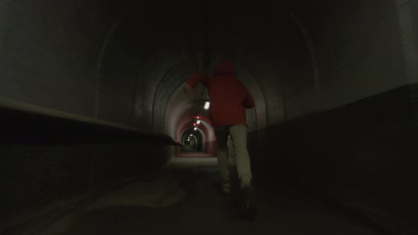 Parkour Athlete Freerunning in Concrete Tunnel