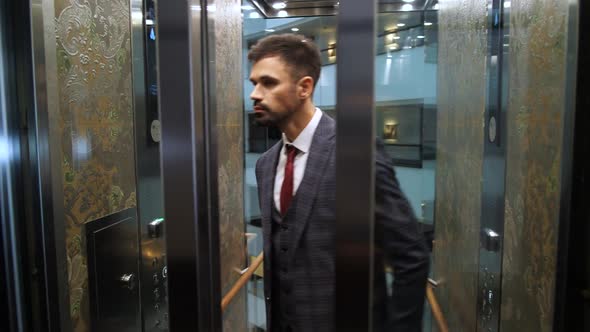 Respectable Man Starting Hotel Elevator To Go Up