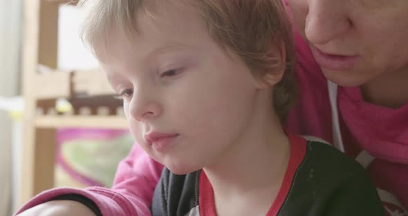 Close up of kid being read to