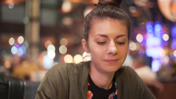 Young Woman Tasting Asian Food with Chopsticks. Excited Girl Trying New Food