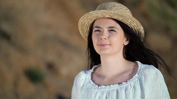 Portrait of Beautiful Woman in White Dress Looks Asides Thoughtfully