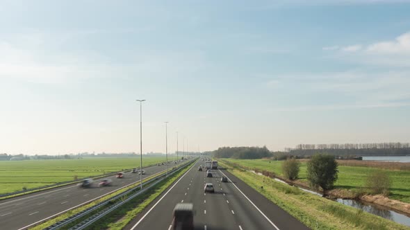 Wide angle time lapse of busy highway traffic, transport infrastructure