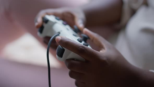 Closeup Game Controller in Female African American Hands