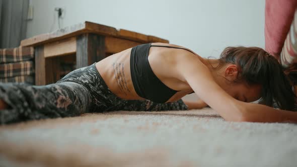 Woman Does Stretching Twine at Home