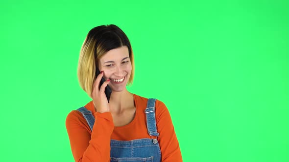 Smiling Girl Talking for Mobile Phone. Green Screen