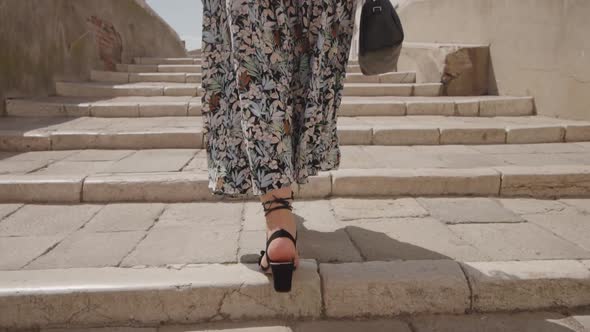 Woman in Heels Climbs the Stairs and Stumbles