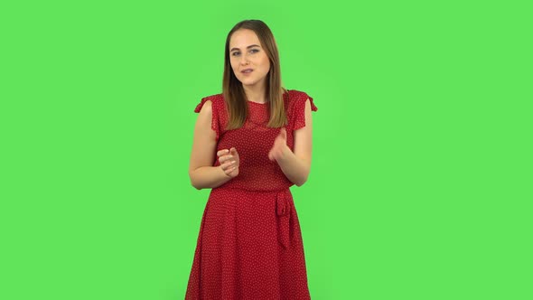 Tender Girl in Red Dress Is Blowing Kiss. Green Screen