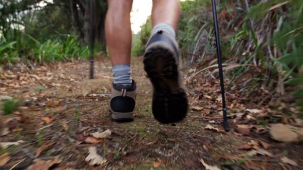 Close up of hiking boots walking