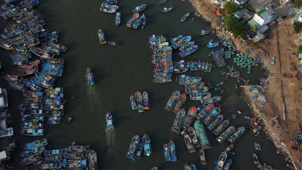 Aerial drone ascent revealing over populated fisherman town of La gi in south Vietnam
