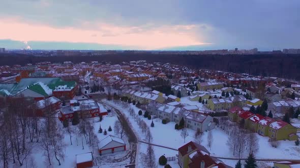 Aerial view of a Russian neighborhood during a light snowfall on a winter night