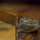 Applying Glue with a Brush on an Old Wood Lacquered Chair - VideoHive Item for Sale