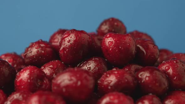 Wet Delicious Cherries on a Rotating Plate