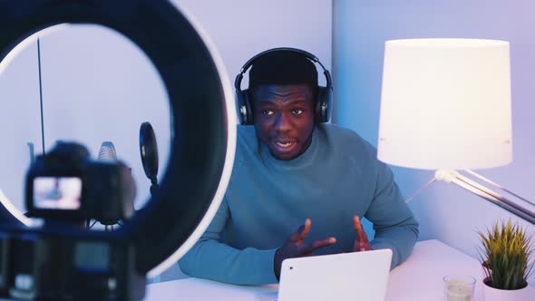 Camera Screen Showing A Man Wearing Headphones Talking While Looking At The Camera