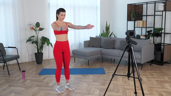 Sport Muscular Woman Records Online Master Class on Camera Workout at Home