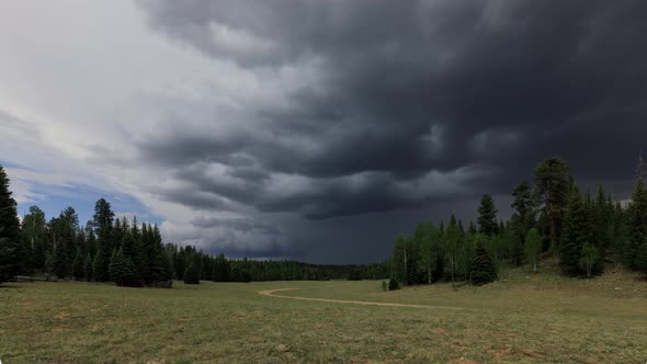 Time Lapse of dark and ominous storm clouds forming over a meadow.