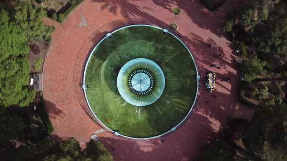 Top down spinning view of a fountain in a park in Mexico City