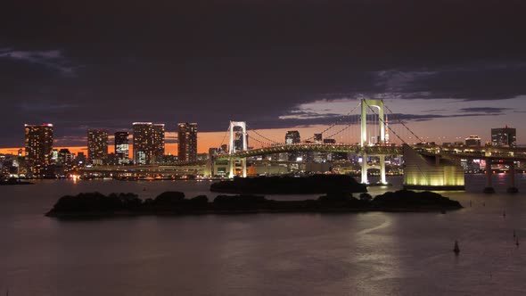 Time Lapse looking across Tokyo Bay at the Rainbow Bridge and Tokyo