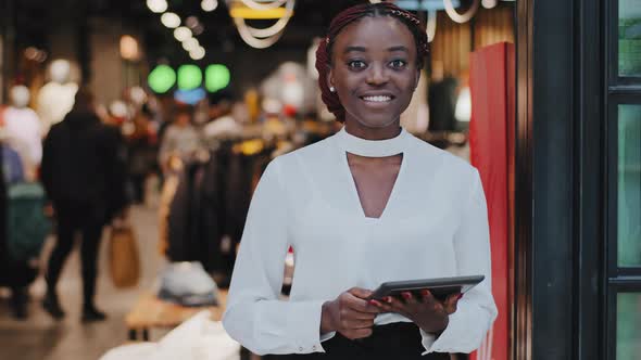 Portrait Afro American Happy Smiling Glad Successful Salesperson Woman Consultant in Clothing Store