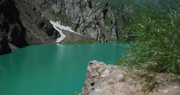 Mountain Lake of green and blue color Urungach. Located in Uzbekistan, Central Asia. 3 out of 10