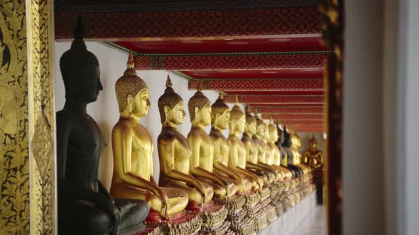 Gold Buddha Statues in Bangkok, Famous Thailand Buildings with a Line of Lots of Buddhist Statues in