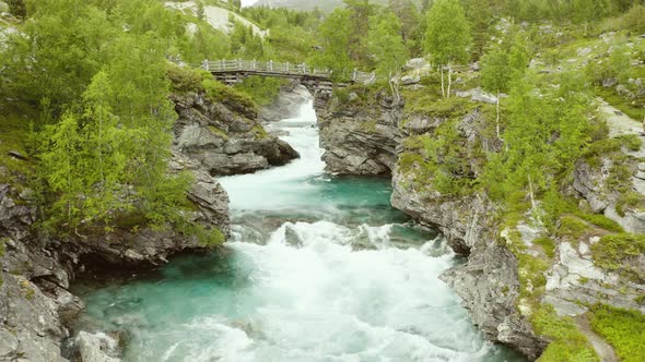 Turquoise Water Of Strynselva River In Surrounded By Rocky Gorges In Stryn, Norway. aerial