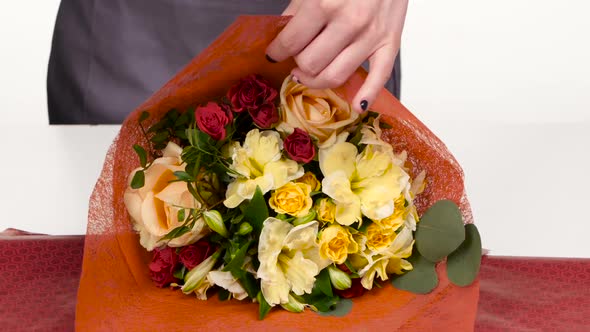 Florist Does a Wrap for Bouquet Flowers