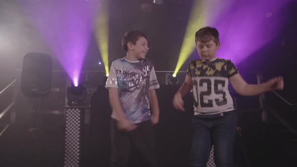 Three Happy Young Boys Dancing at a Party / Disco - Ungraded